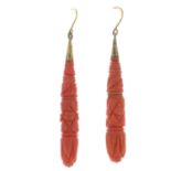 A pair of late 19th century gold carved coral earrings.Coral untested.Length 6.6cms.