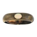 An early 20th century gold opal cabochon clip.Stamped 18ct.Length 3cms.