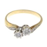 A brilliant-cut diamond two-stone crossover ring.Ring size M1/2.