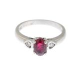 An 18ct gold ruby and diamond three-stone ring.Hallmarks for 18ct gold.