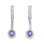 A pair of sapphire and diamond drop earrings.Estimated total diamond weight 0.60ct.
