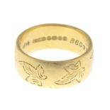 An 18ct gold band ring.Hallmarks for Birmingham, 1967.