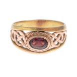 A 9ct gold garnet bi-colour ring, by Clogau.Maker's marks for Clogau.