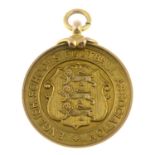 An early 20th century 9ct gold 'English Schools Football Association' medallion.Hallmarks for