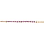 A ruby and brilliant-cut diamond bracelet.Estimated total diamond weight 0.25ct.Length 18cms.