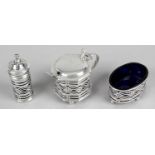 A matched silver three piece condiment set,