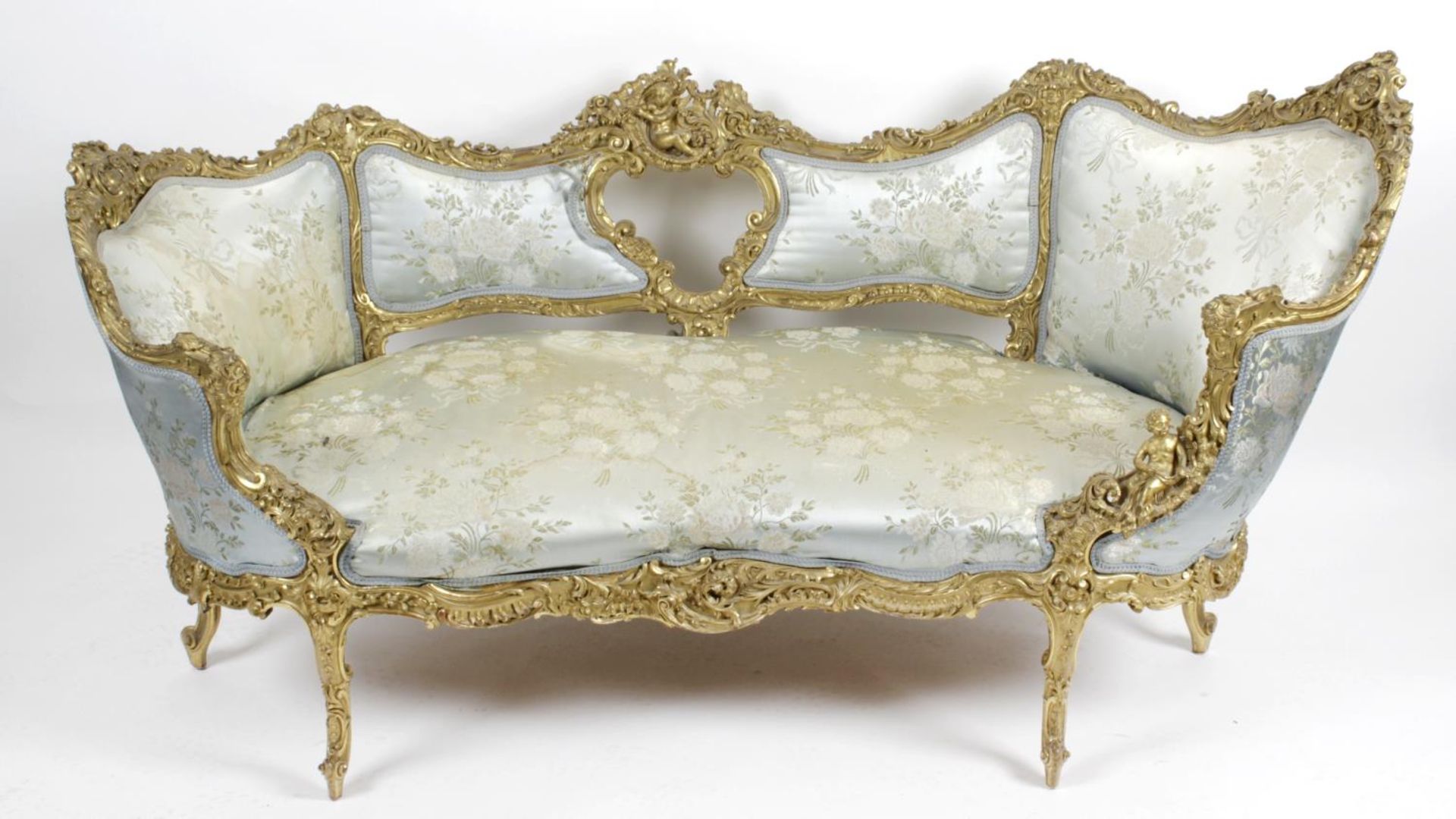 A carved and moulded gilt wood sofa,
