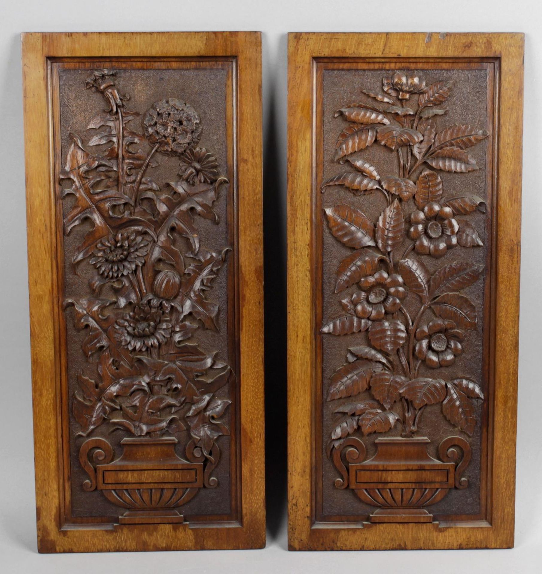 Three rectangular carved mahogany panels,