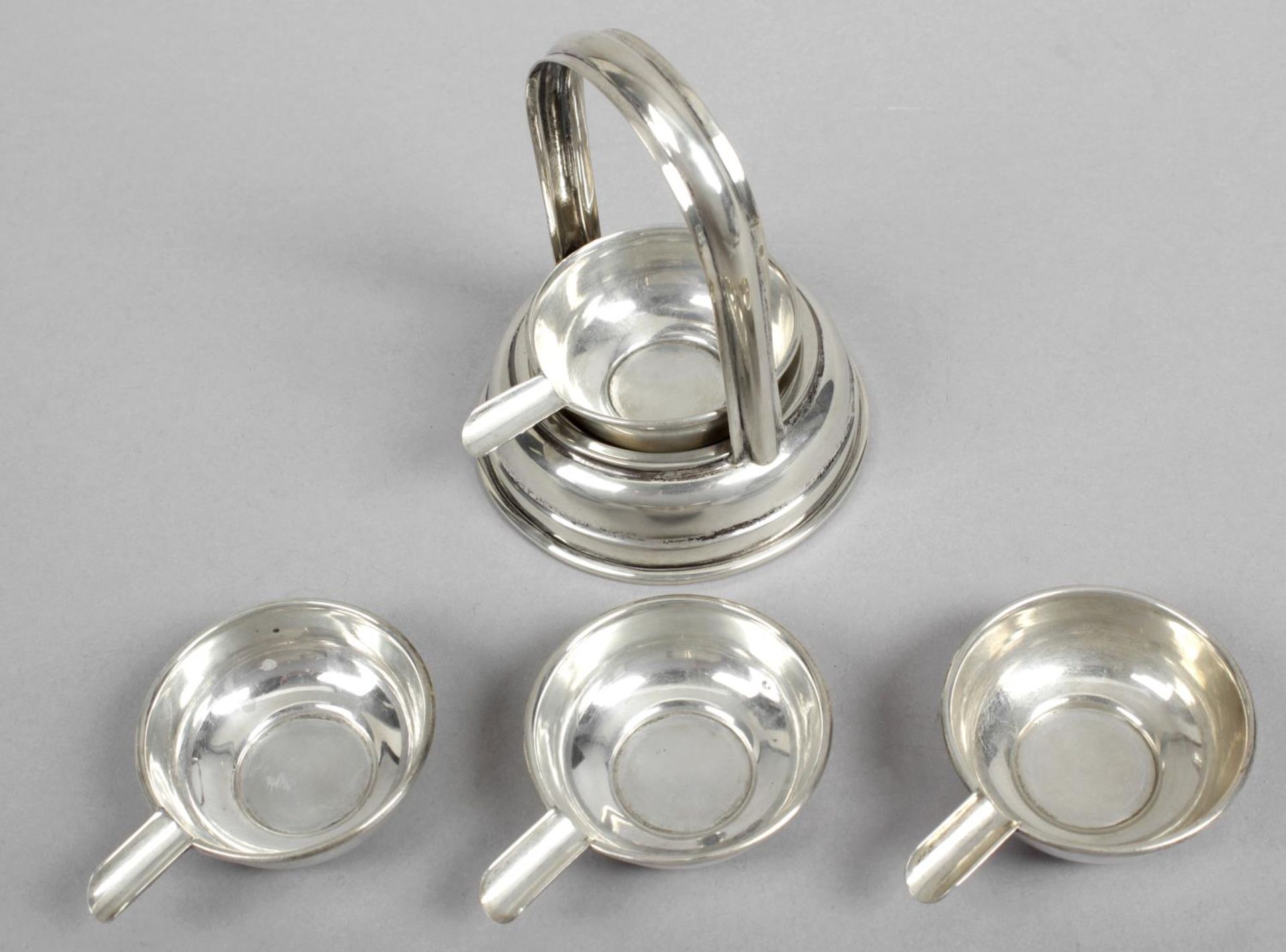 A set of four small Portuguese silver ashtrays & stand,