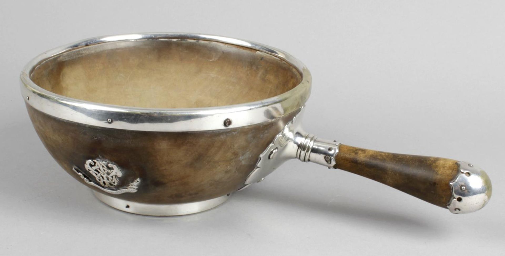 A 19th century turned walnut bowl with applied plated mounts and single handle to side,