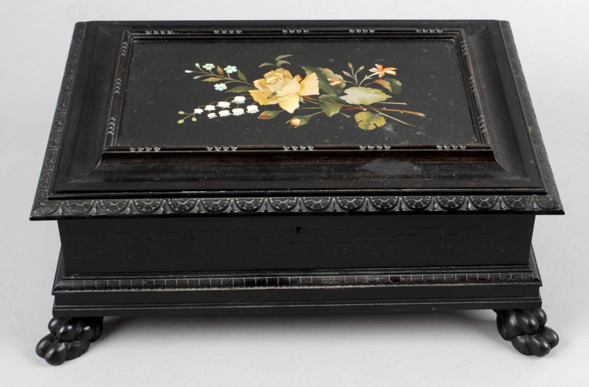 A 19th century carved ebonised wooden box,