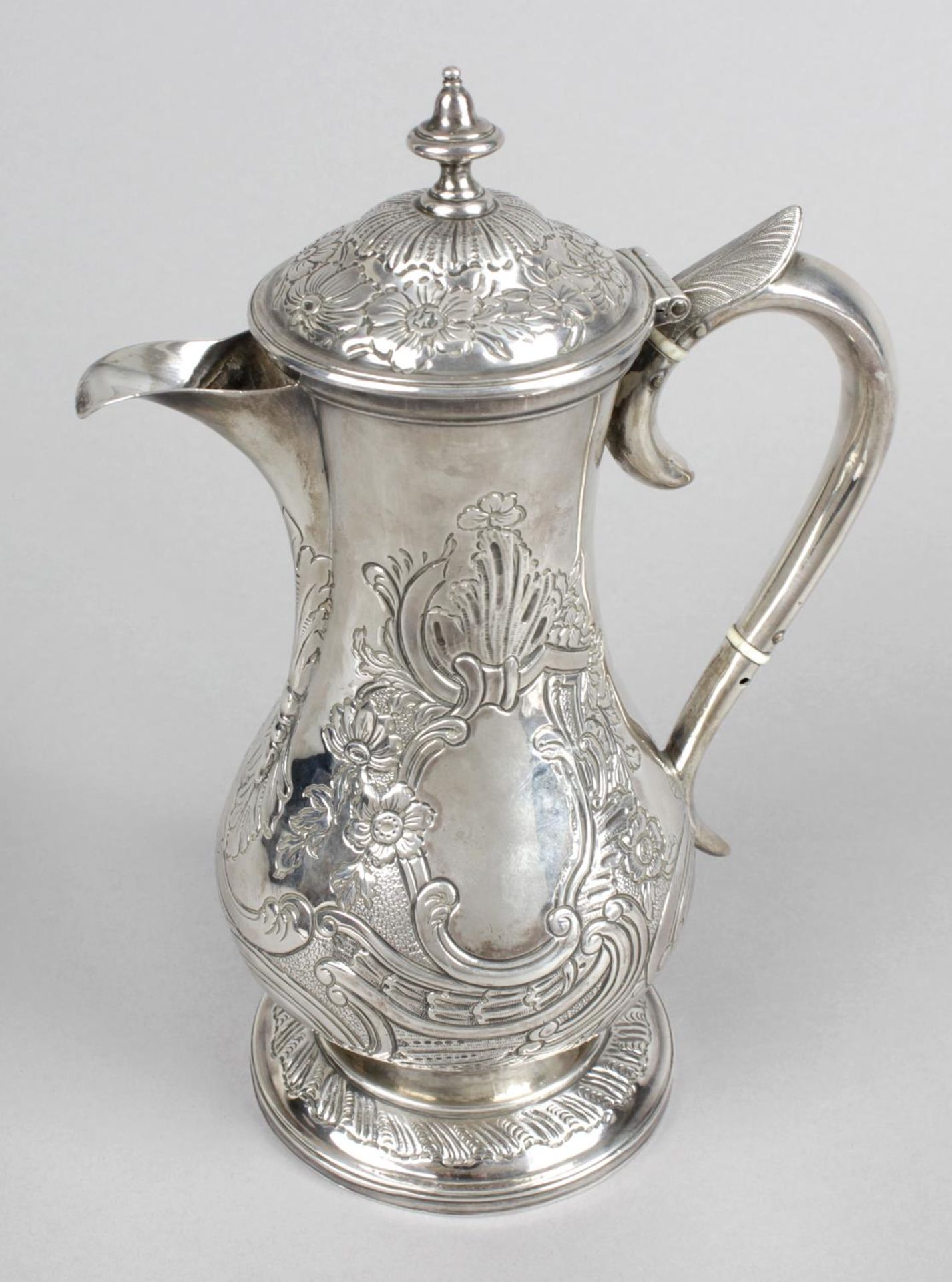 An early George III silver hot water pot,