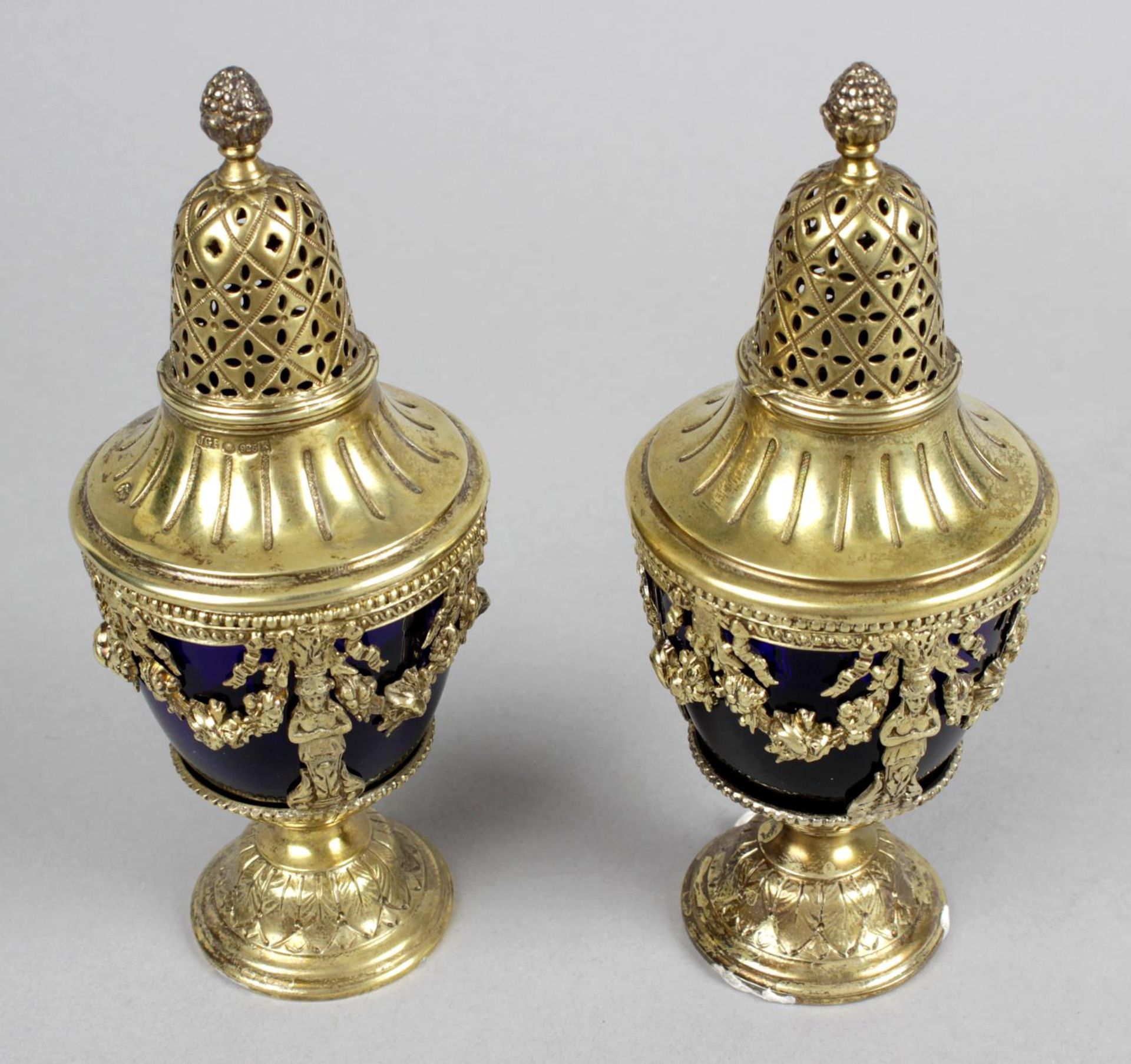 A pair of early 20th century silver-gilt casters,