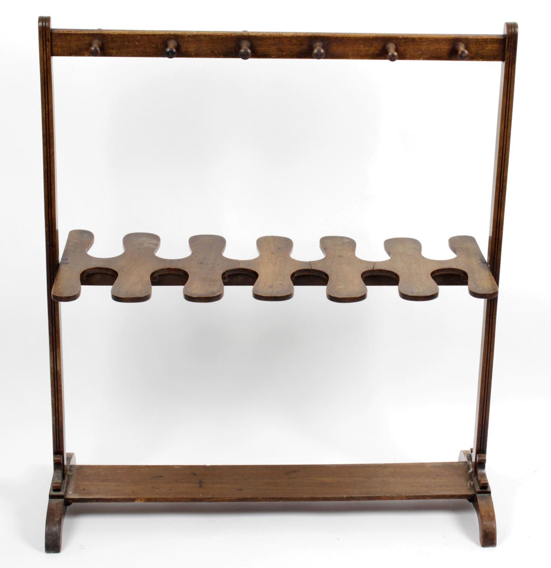 An early 20th century mahogany boot rack and riding crop stand,