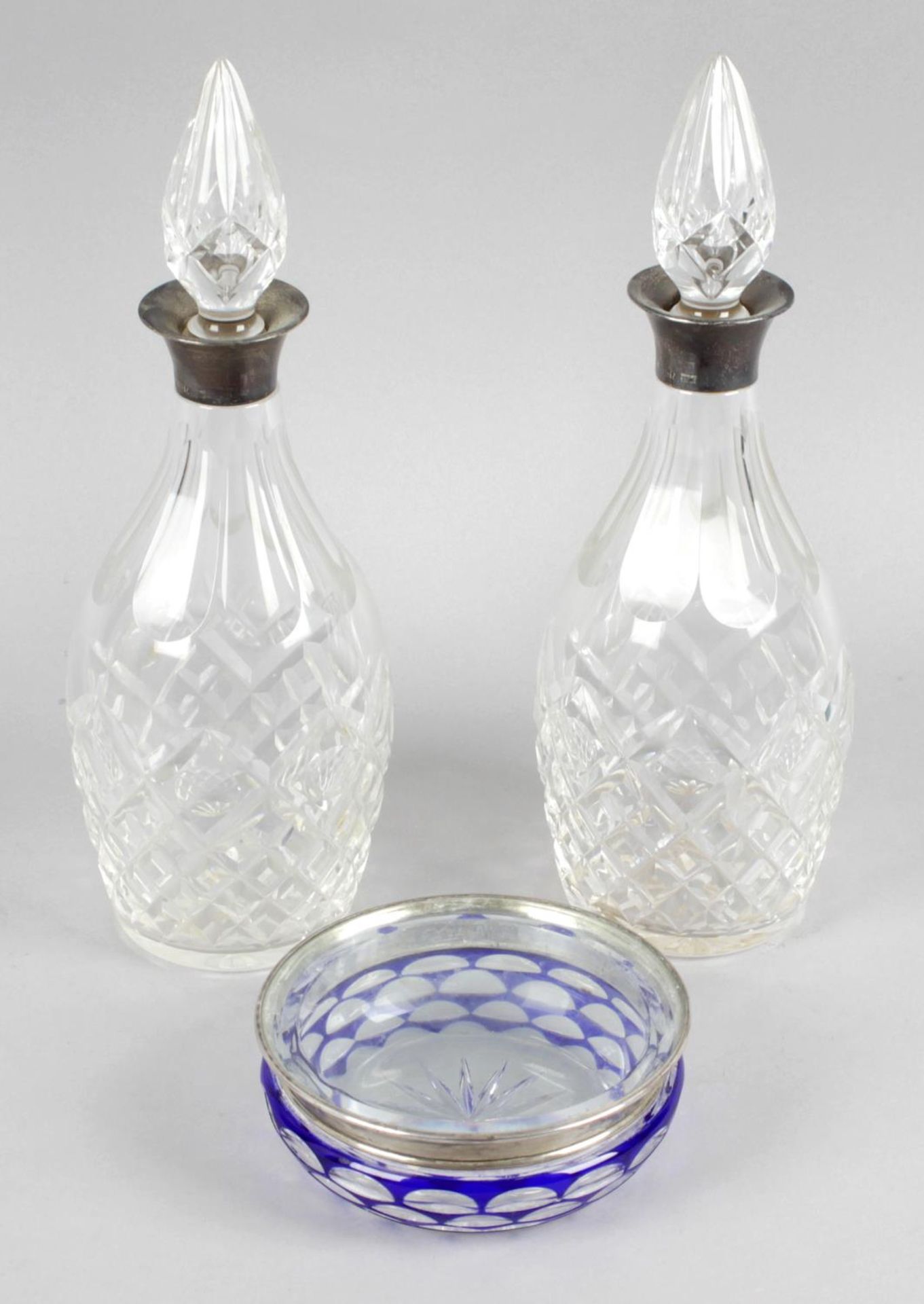 A pair of cut glass decanters and stoppers,