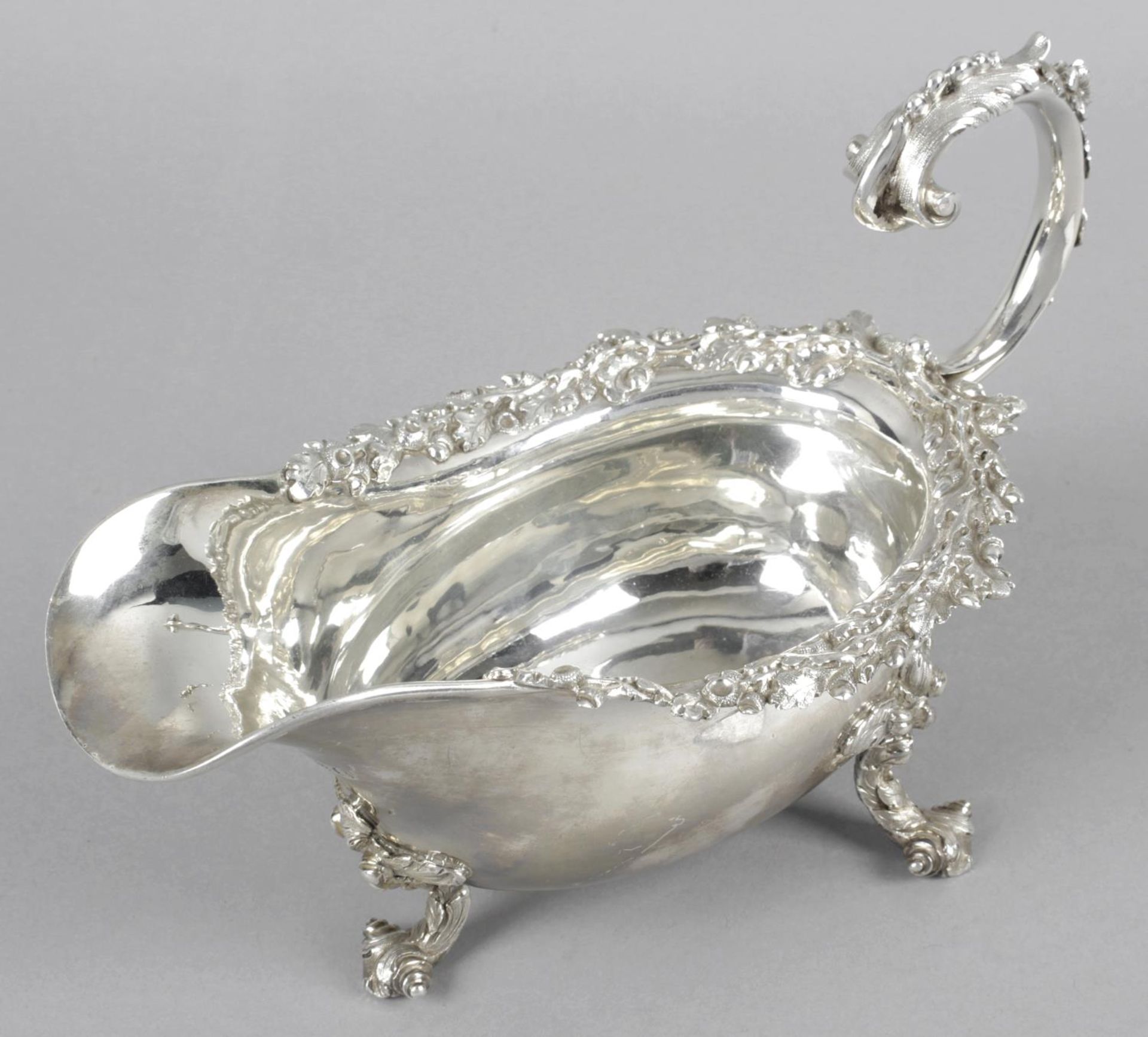 A George IV silver sauce boat,