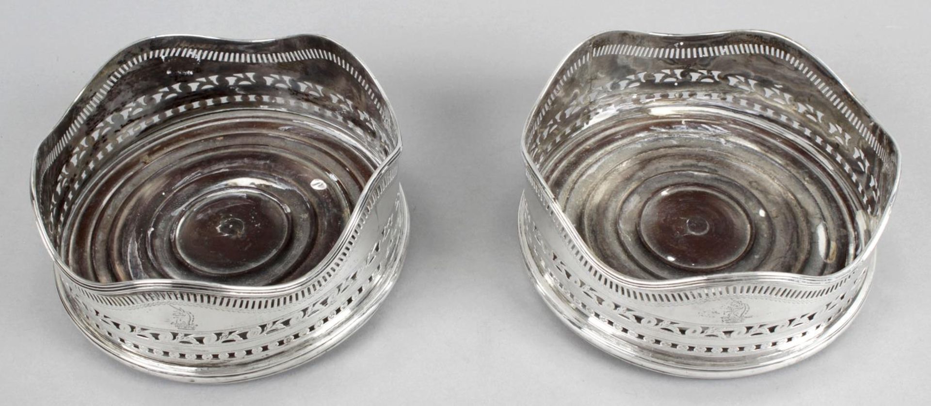 A pair of George III Irish silver mounted wine coasters,