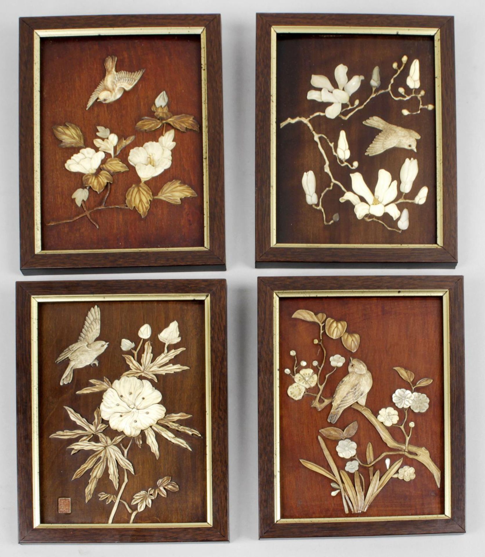 Four small late 19th century Japanese wooden panels,