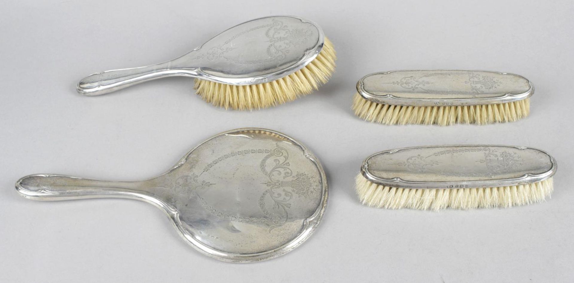 A George V silver mounted part dressing table set,