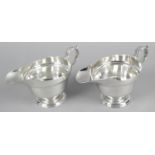 A fine pair of early George II silver sauce boats,