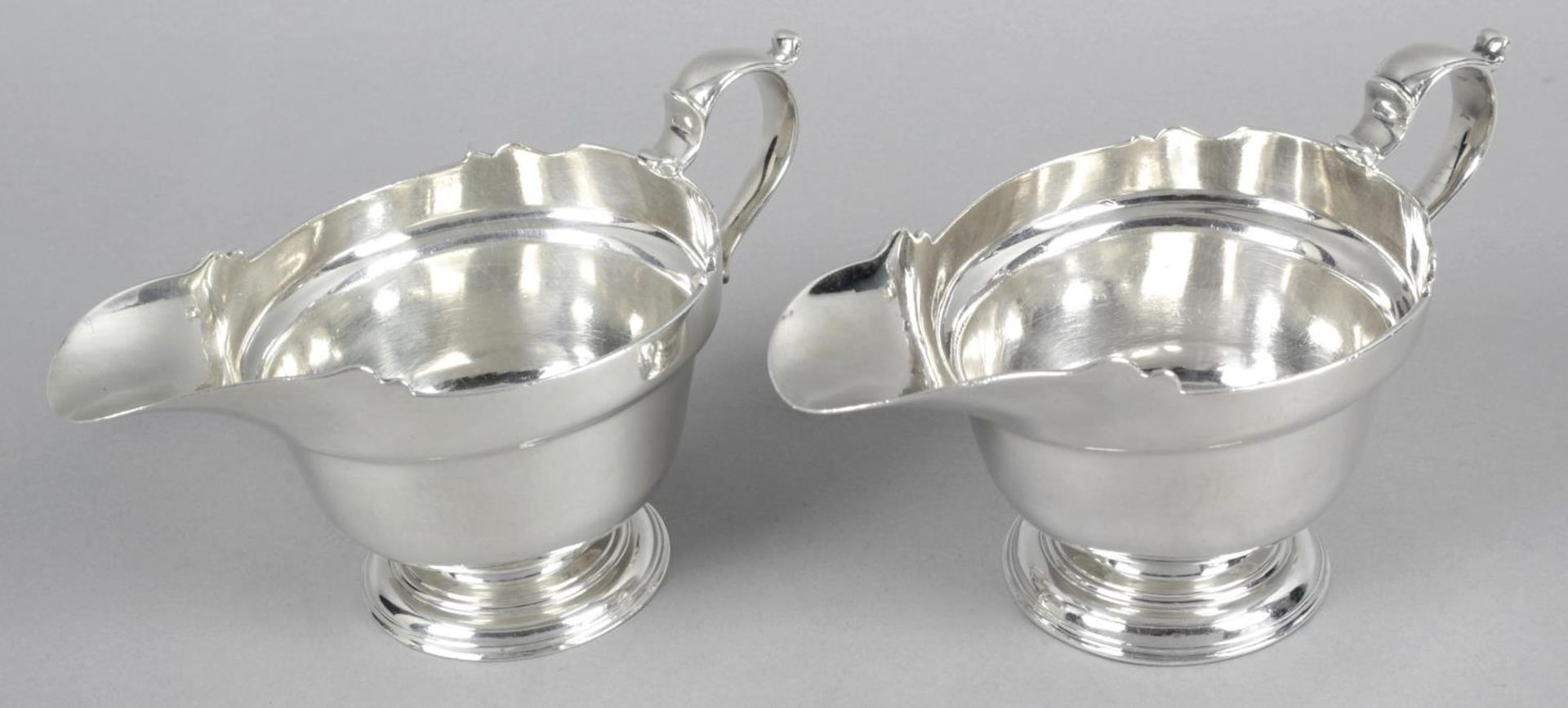 A fine pair of early George II silver sauce boats,