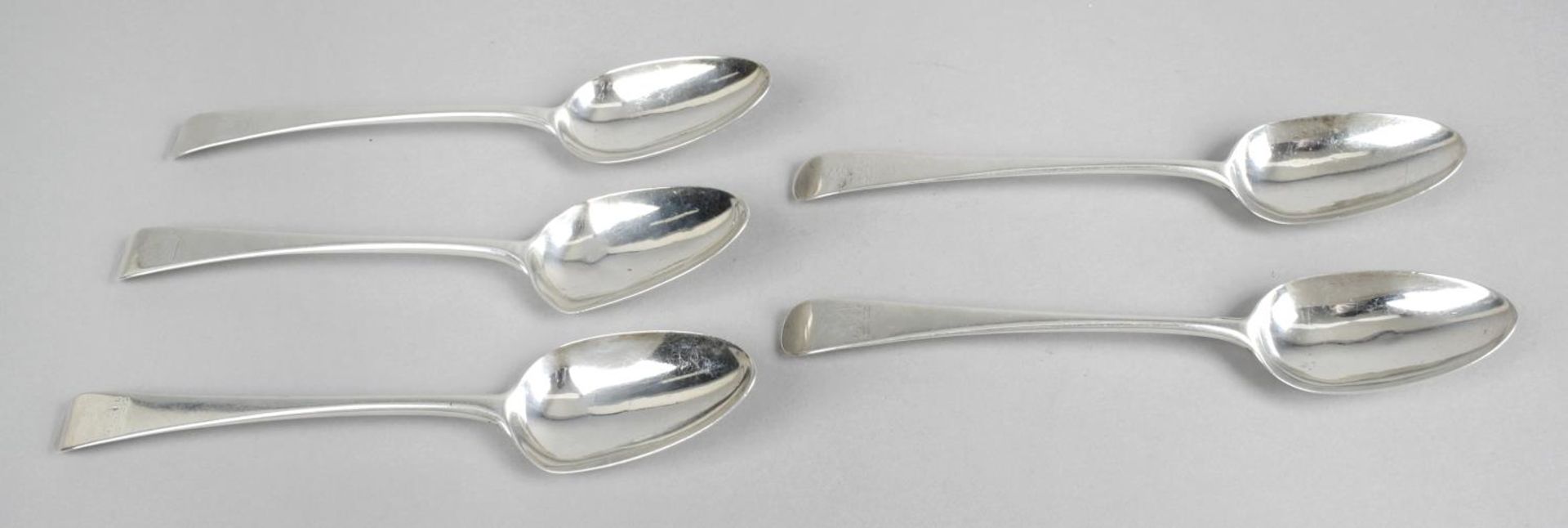 A set of five George III silver table spoons,