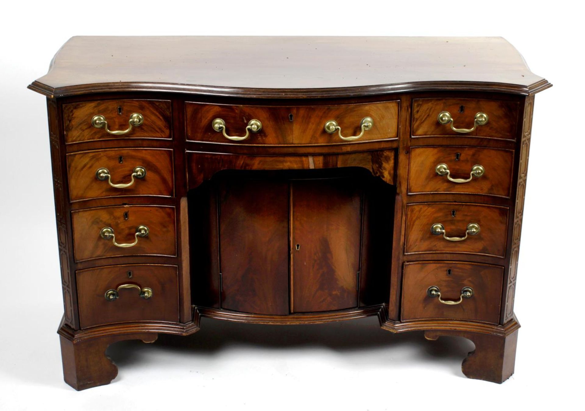 A Marsh, Jones & Cribb early 20th century mahogany knee-hole chest,