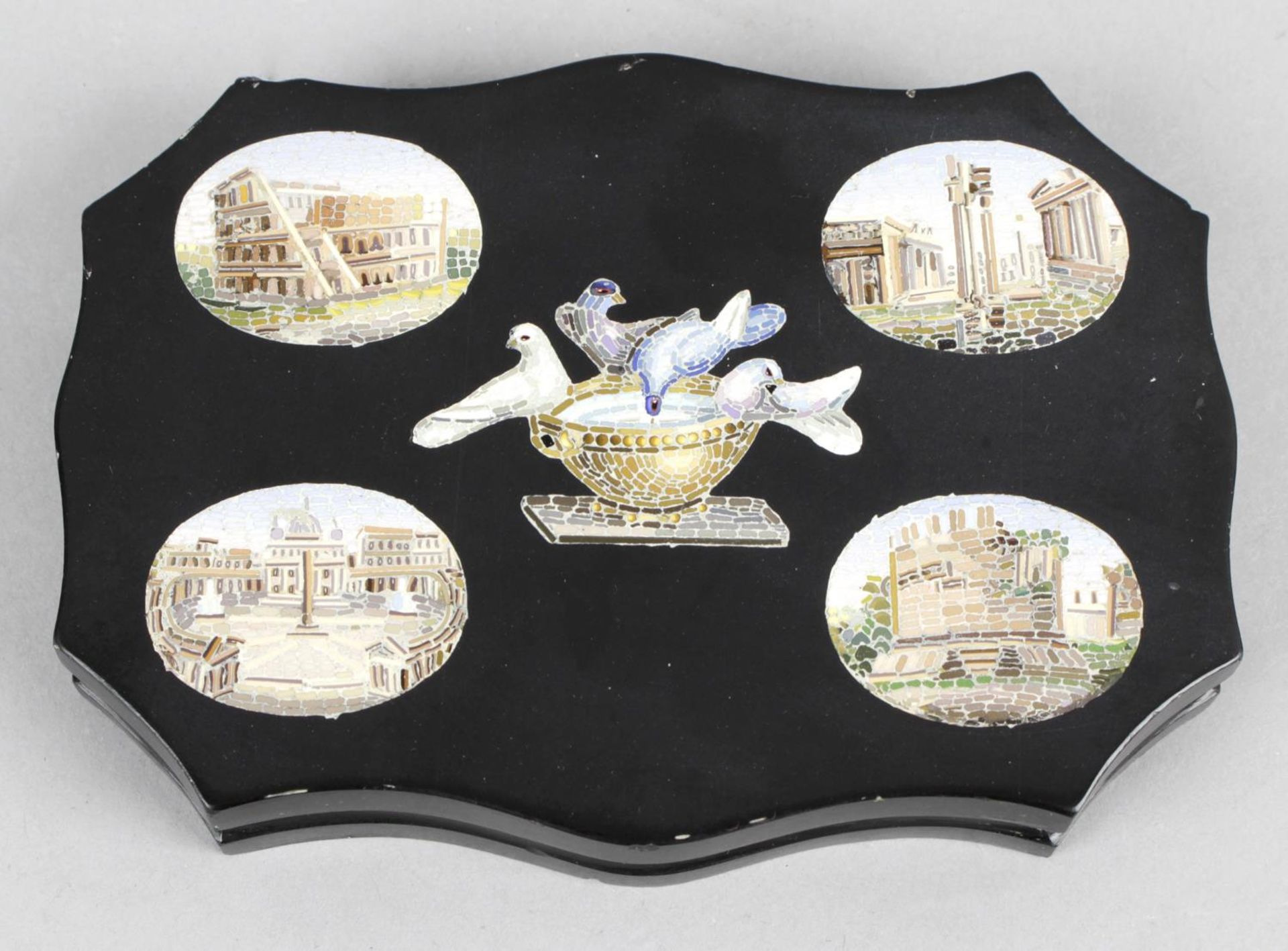 A 19th century Italian Grand Tour souvenir micromosaic desk weight of oval serpentine form,