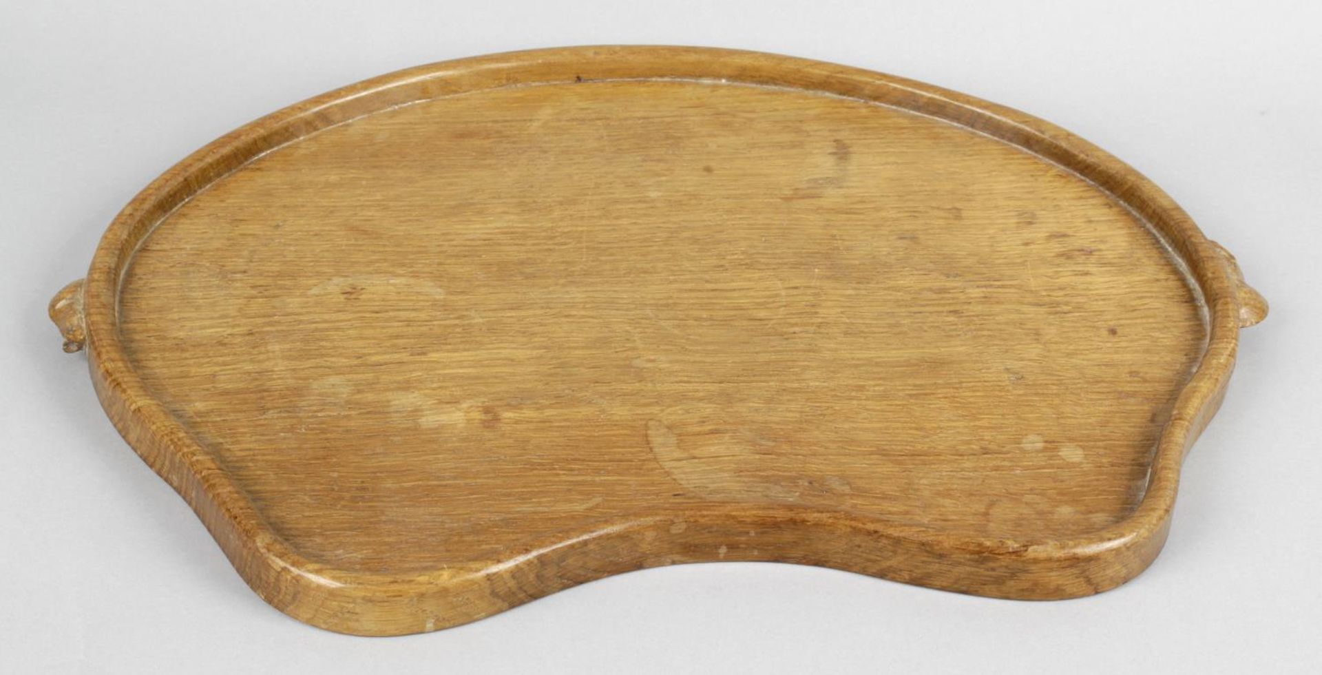 A carved wooden Mouseman tray of kidney shape,