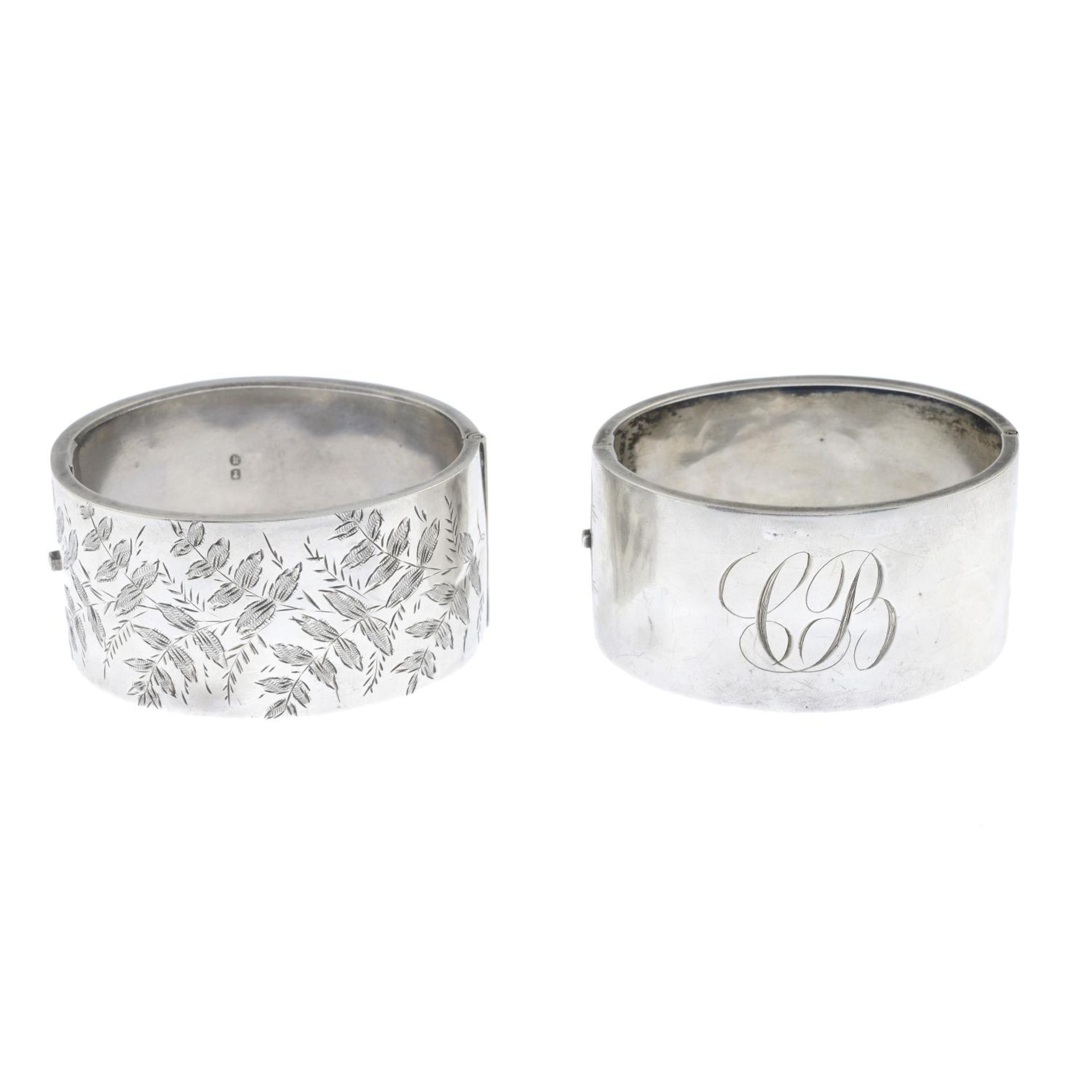 A late Victorian silver bangle and a further bangle.