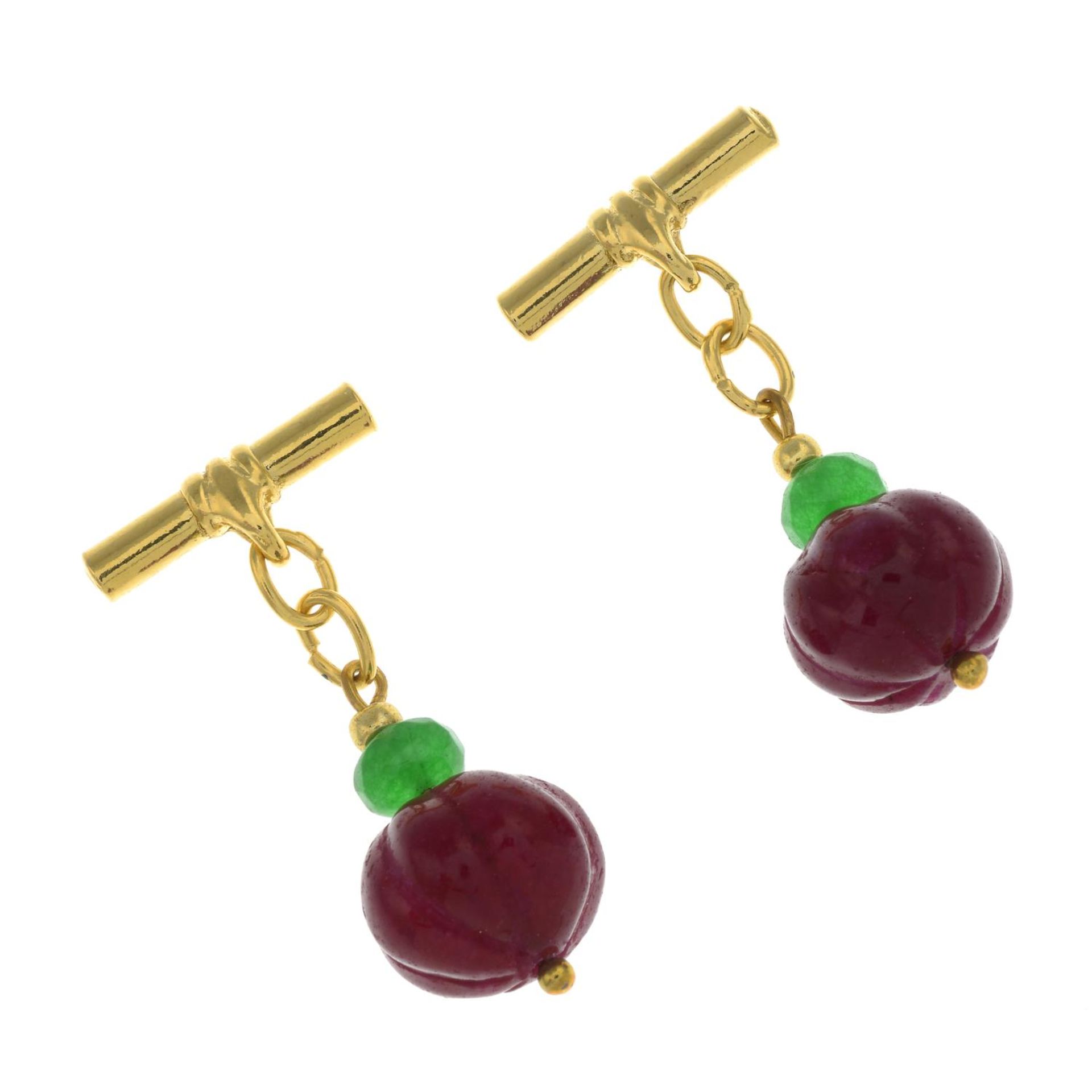 A pair of glass-filled ruby and green gem cufflinks.Length of cufflink faces 1.2 and 1.7cms.