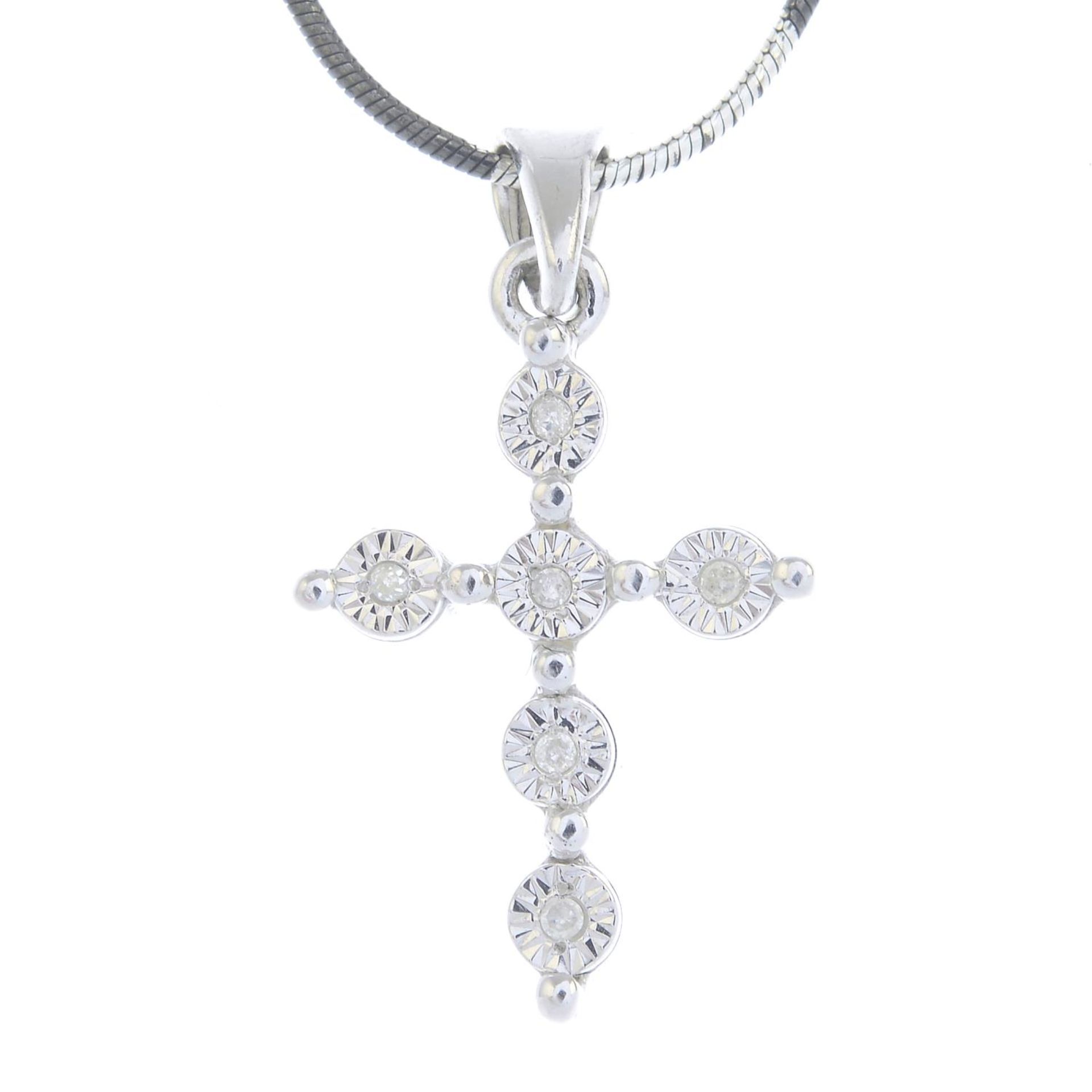 A single-cut diamond cross pendant,