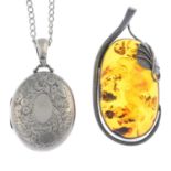 A late Victorian silver locket, chain and an amber pendant.Hallmarks for Birmingham, 1886.