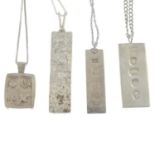 Four silver ingot necklaces.