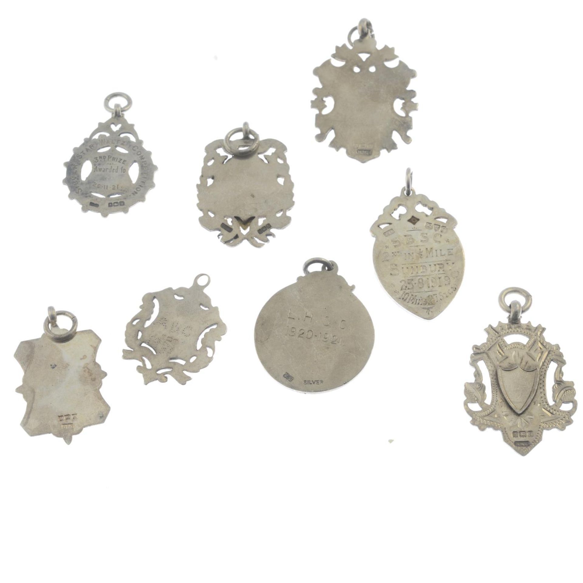 Eight silver medallions.Hallmarks for Birmingham and Chester, 1919 to 1950.Lengths 3.4 to 4.6cms. - Bild 2 aus 2