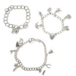 Three silver charm bracelets.