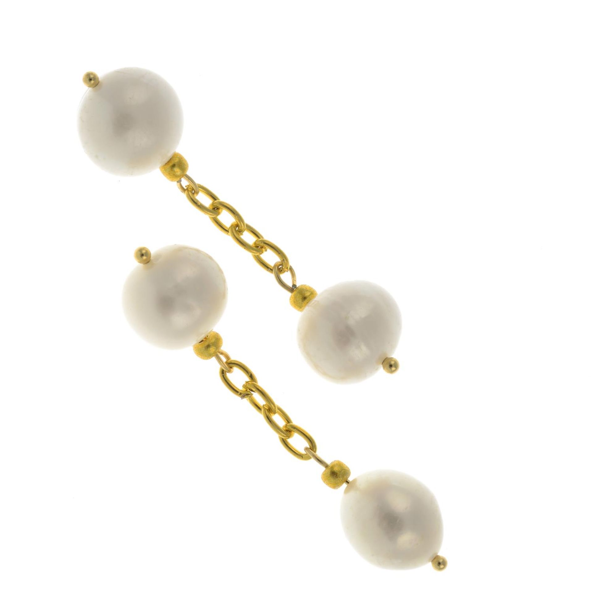 A pair of freshwater cultured pearl cufflinks.Lengths cufflink faces 0.9 to 1.1cms.