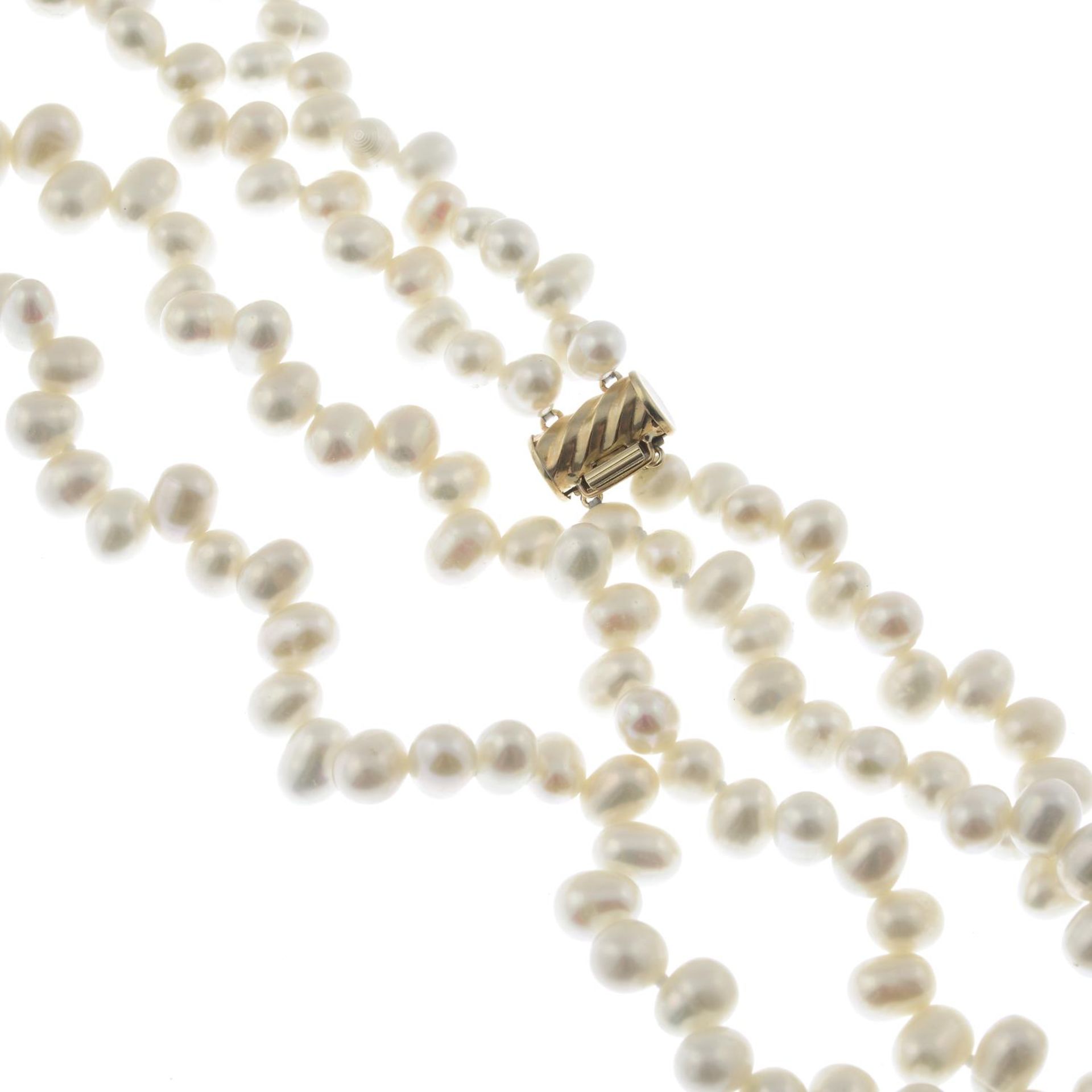 A two row cultured pearl necklace and three bangles.