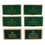 ROLEX - a group of six assorted watch display signs,