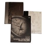 PATEK PHILIPPE - a collection book with four assorted catalogues.