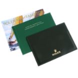 ROLEX - a group of eleven wallets with Rolex Yacht-Master booklets and a Rolex Daytona booklet.