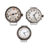 A group of six assorted silver trench style wrist watches.