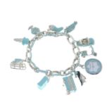 A silver 'Blue Clasping Bracelet' and eleven charms, by Tiffany & Co.Signed T & Co 'Italy'.