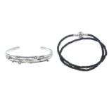 A silver gem-set bracelet, by Links of London and a cord bracelet, by Pandora.