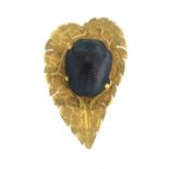 A novelty brooch, designed as a scarab on a leaf.