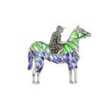 A pyrite and plique-a-jour enamel brooch, depicting a jockey on a horse.May be worn as a pendant.