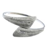 A selection of bangles.Many with marks to indicate silver.185.2gms.