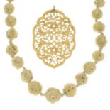 A selection of antique ivory jewellery,