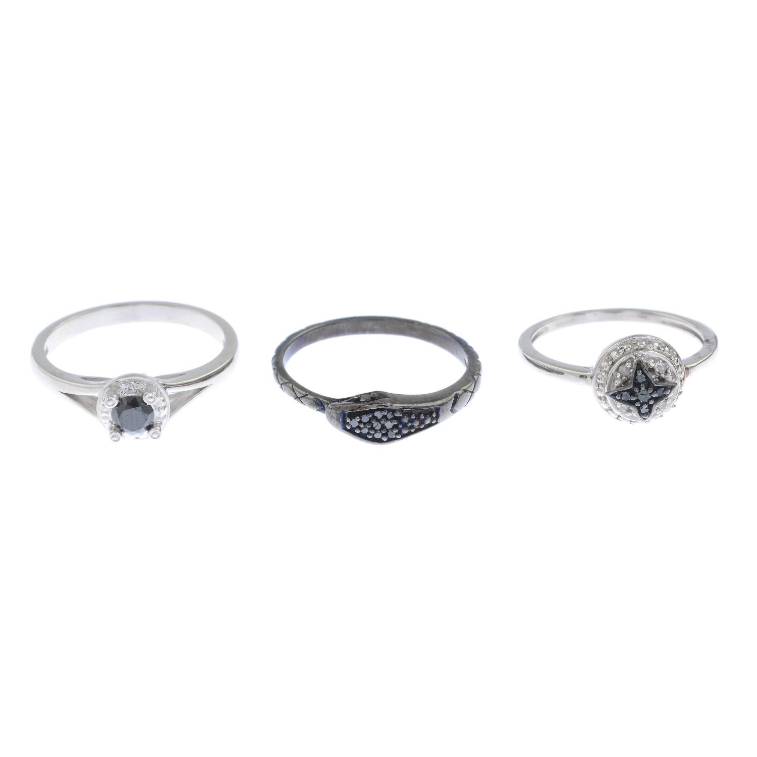 Six vari-cut diamond dress rings.Stamped 925.