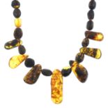 Two modified amber bead necklaces and a bakelite bead necklace.